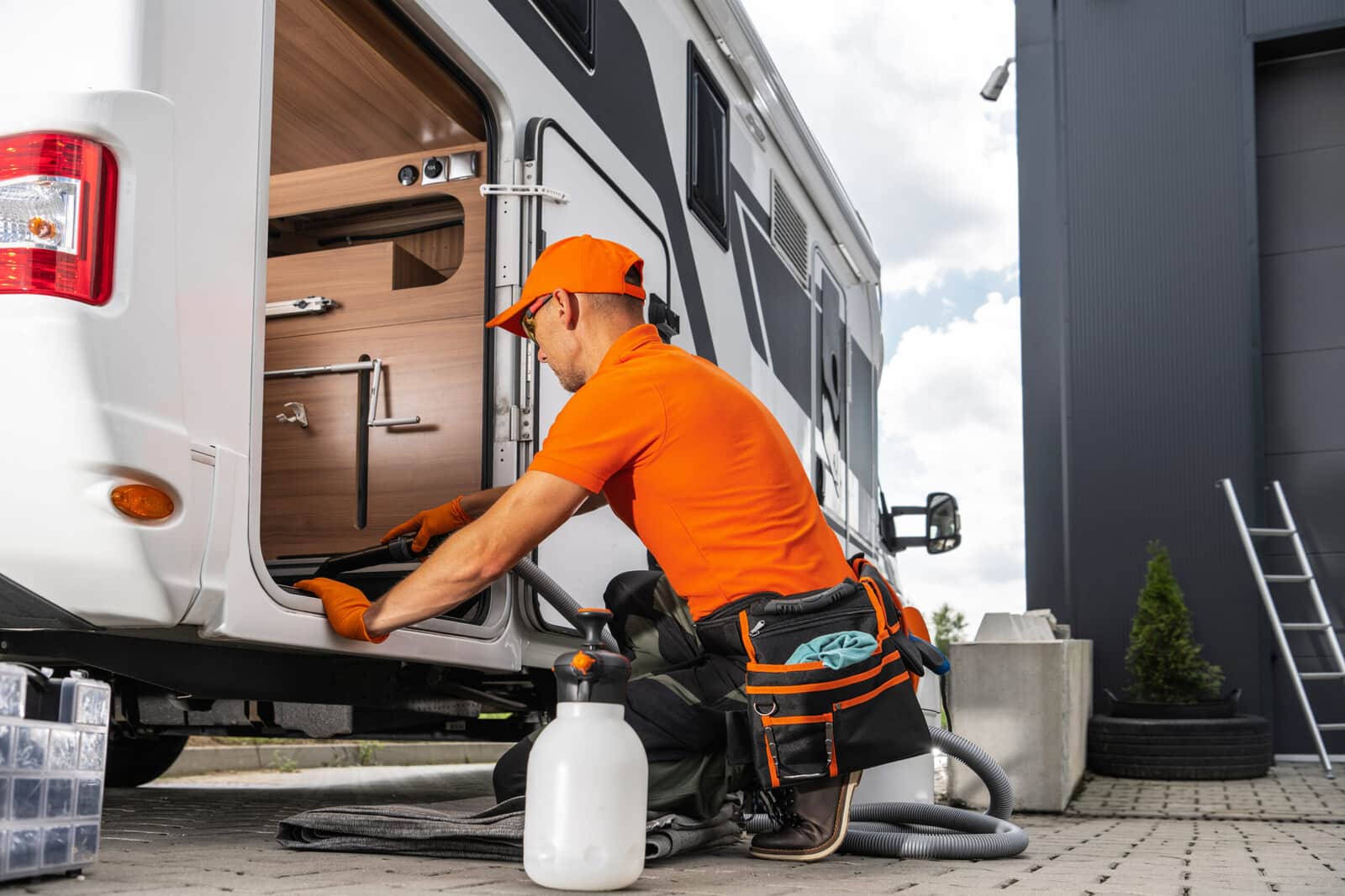 The interior wall, ceiling, and cabinetry of an RV camper.